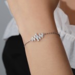 Spiralux - Adjustable Moissanite Bracelet with Pave Symbol Design