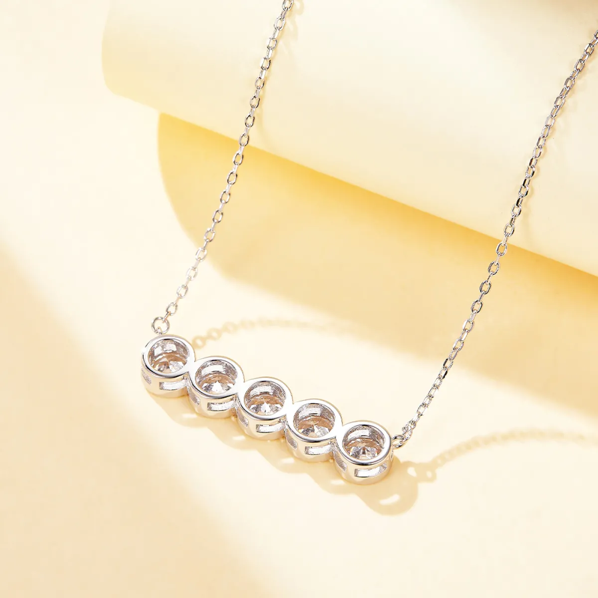 Quinta - Five Stone Moissanite Necklace in Bezel Setting