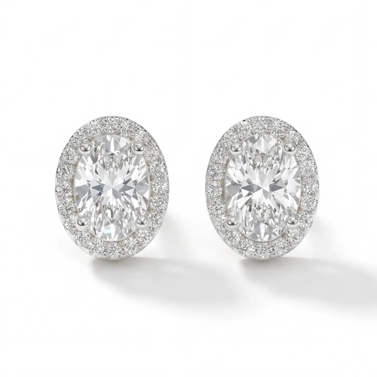 Ellipse - Oval Moissanite Stud Earrings in Halo Setting